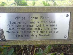 Plaque on seat above White Horse farm