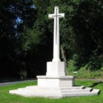 Image of war memorial, a portland stone cross of sacrifice with a bronze sword