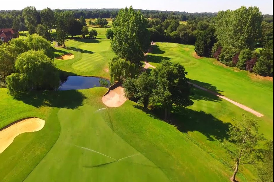 Aerial view of part of sand martins gold course showing greens, bunkers and trees