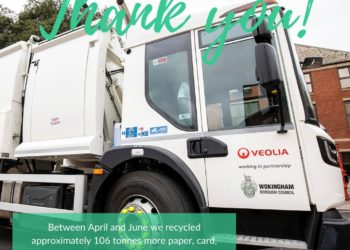 Large white recycling truck with thank you written across it