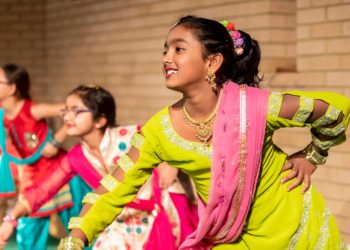 Young girls in colourful indian dress dancing