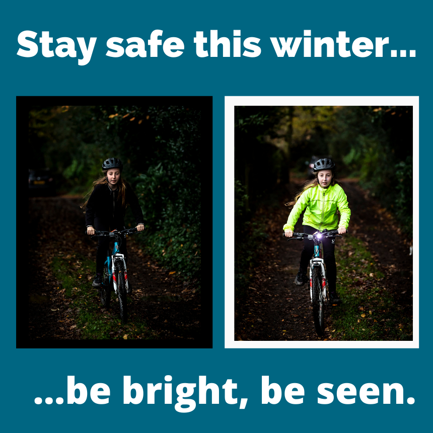 Picture of child in dark clothing on bicycle and another in hi vis clothing