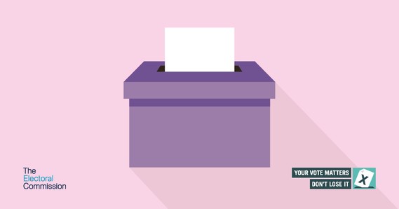 Purple box with white election vote being inserted
