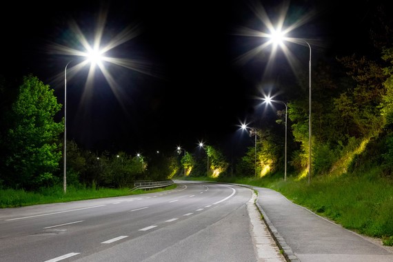 road at night with illuminated street lights